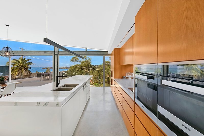 Large Windows Providing Ample Light at Wamberal Kitchen by Planit Kitchens