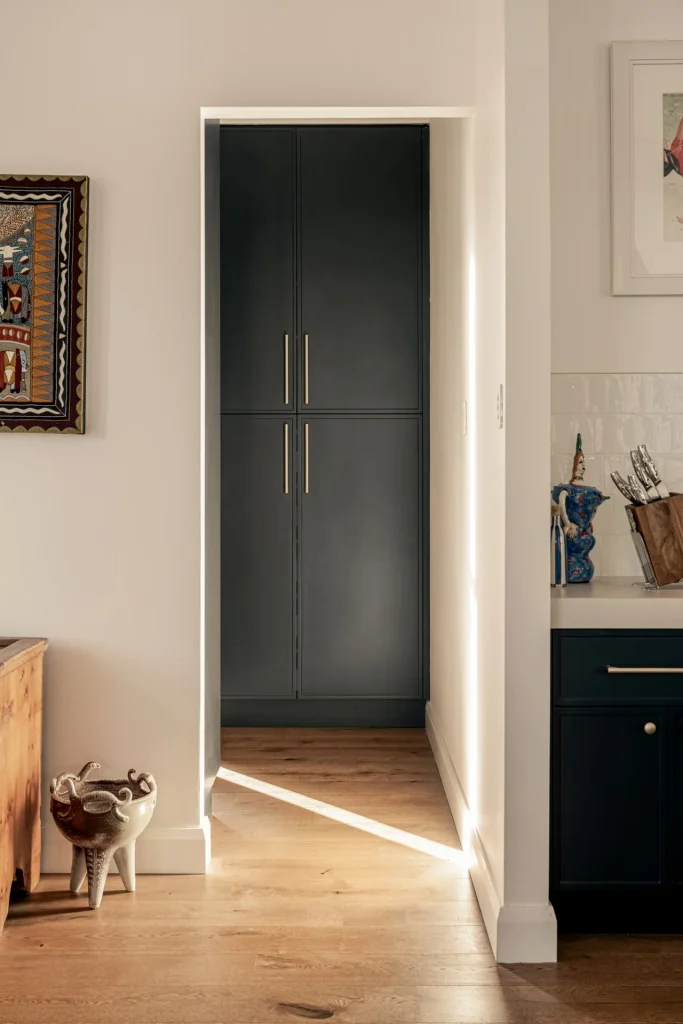 Award-Winning Entertainer's Kitchen in Belford 5 06 tall pantry cabinetry navy 1