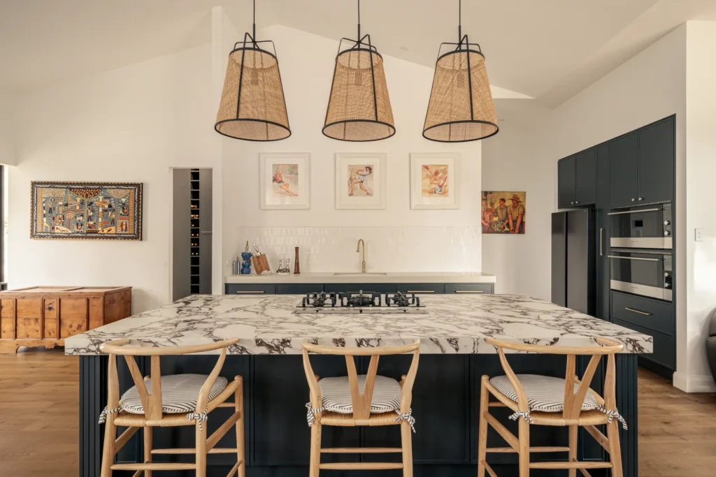 navy kitchen island marble benchtop rattan pendants
