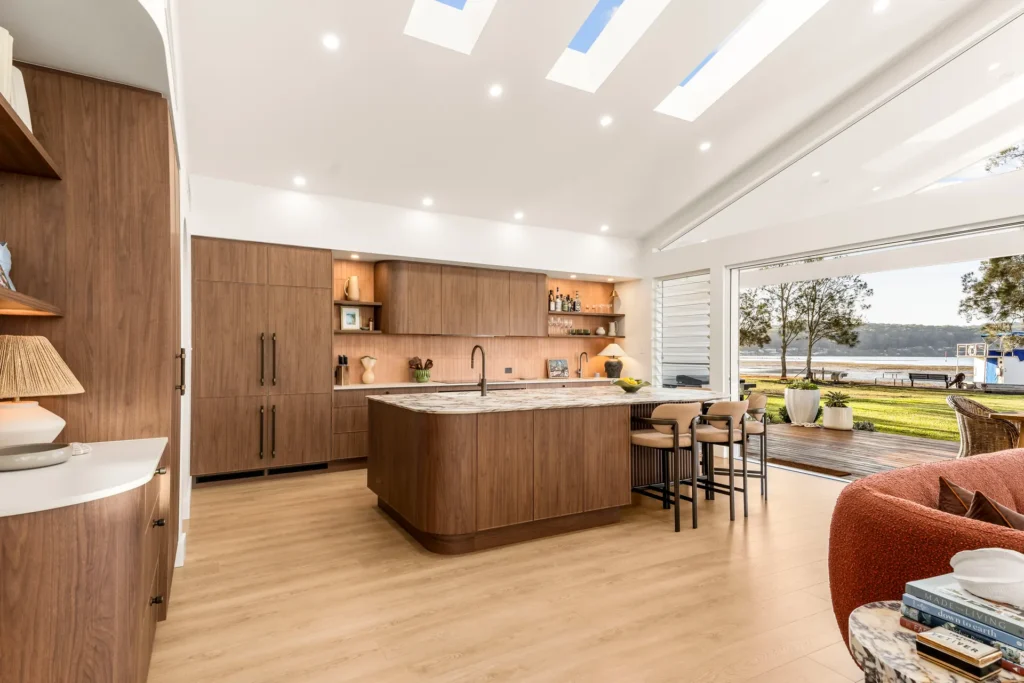 walnut kitchen curved island skylights waterfront